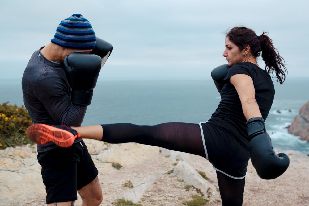 Boxers exercising on cliff
