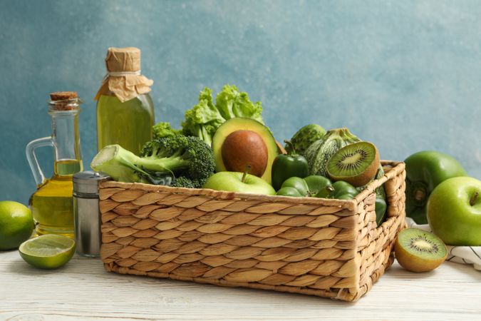 Concept of healthy food with vegetables and fruits on wooden table