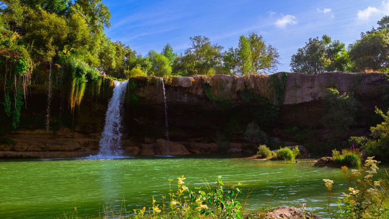 View of beautiful waterfall and lake