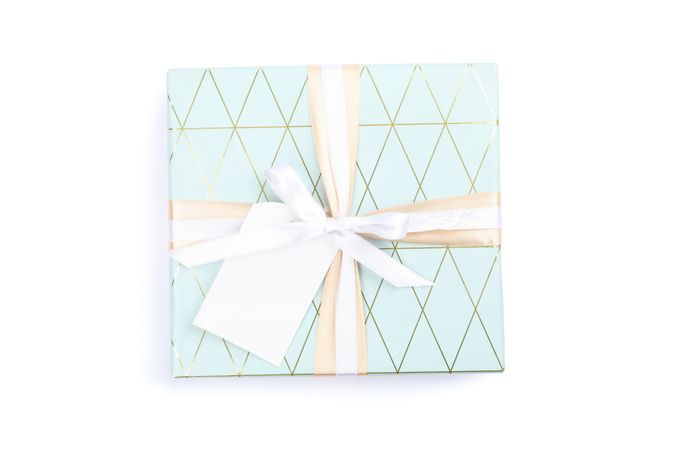 Beautiful gift box with bow and label isolated on blank background