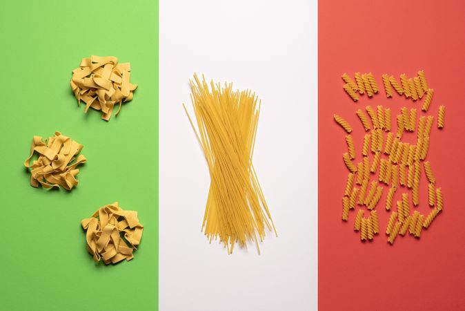 Pasta variety on Italian flag background