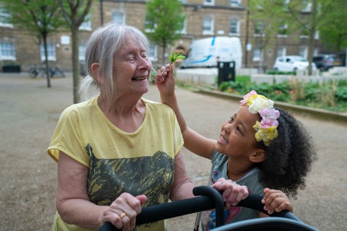 Older woman and grandchild walking outside