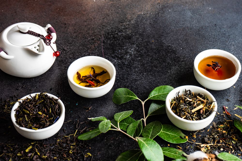 Loose leaf tea variety with tea pot and cup