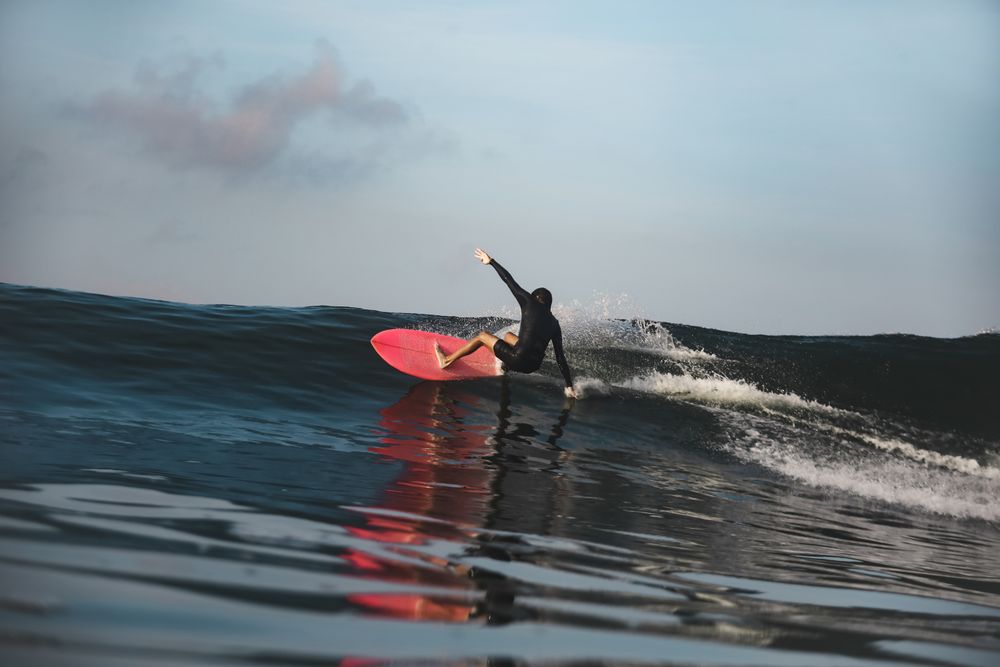 Man on surf board on waving water