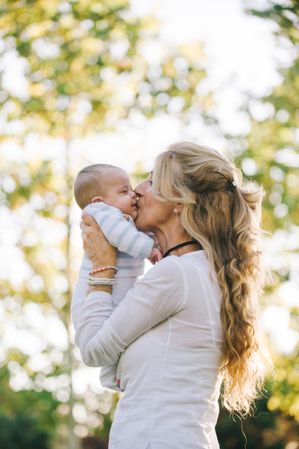 grandmother holding her grandson with down syndrome