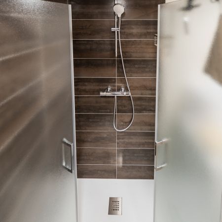 New shower cabin after renovation. Purity and freshness.