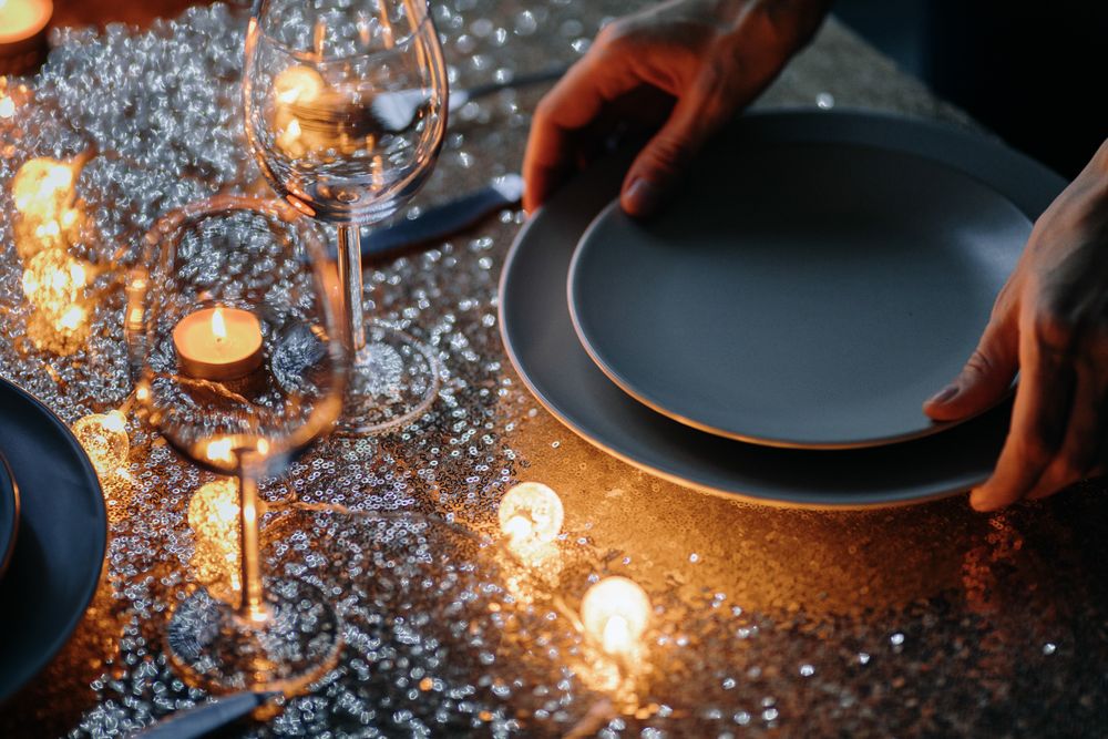 Hands placing holiday plates