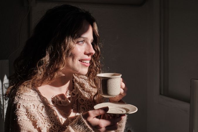 Young woman with cup of coffee
