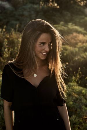 Cheerful woman looking away