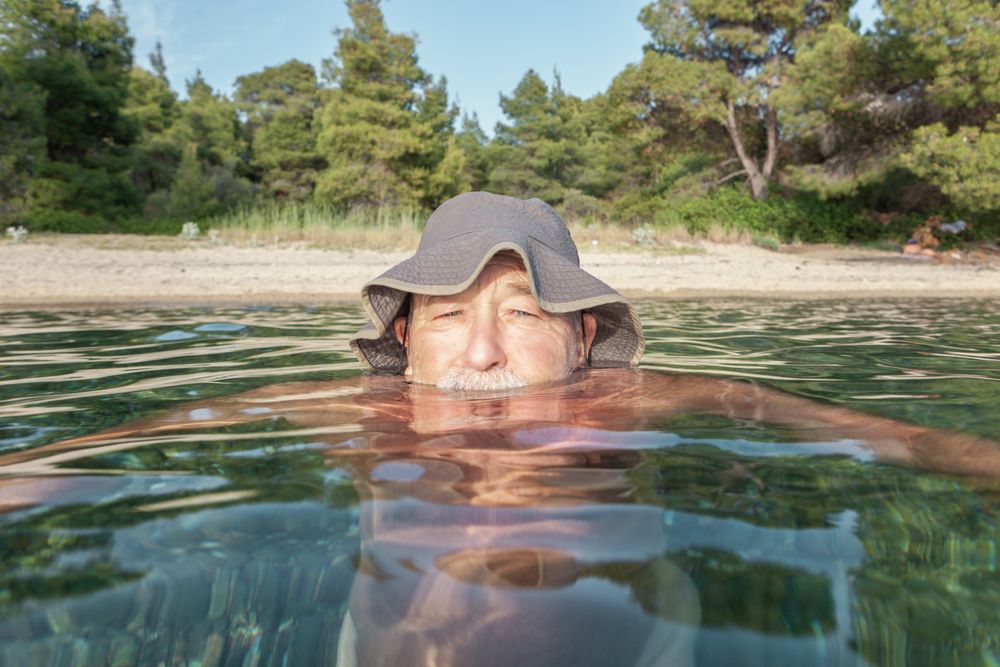 Man swimming under water in sea