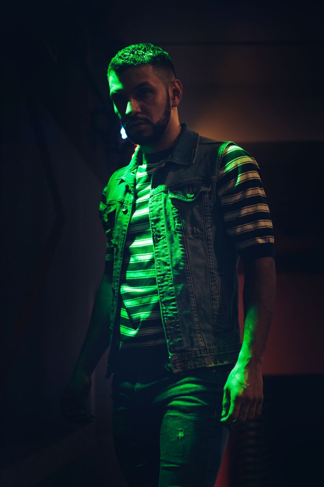 bearded man dancing in spotlight