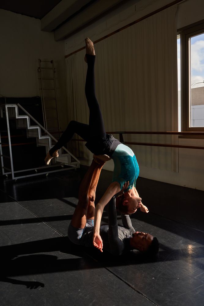 Male and female in a class doing a training in ballet academy