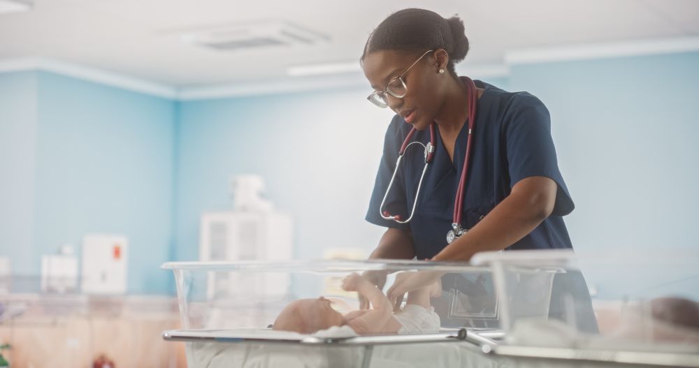 Cute Newborn Baby Lying in Bassinet in a Maternity Hospital.