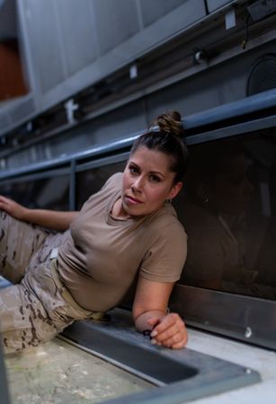 Military woman inside modern vehicle