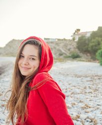 woman with shy smile looking at camera