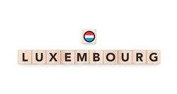 Wooden blocks bearing the name and flag of Luxembourg. Luxembourgger and European Culture, national identity, travel, and geography in a copy space design.