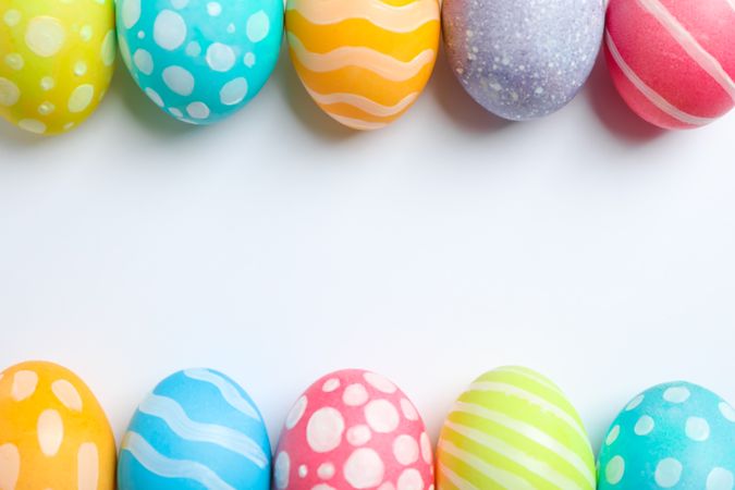 Decorative Easter eggs on neutral background, space for text. Top view