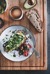 Flat-lay of avocado toast on sourdough bread, on wooden board