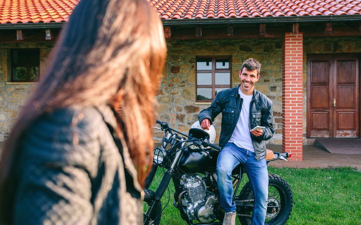 Man sitting on a custom motorbike