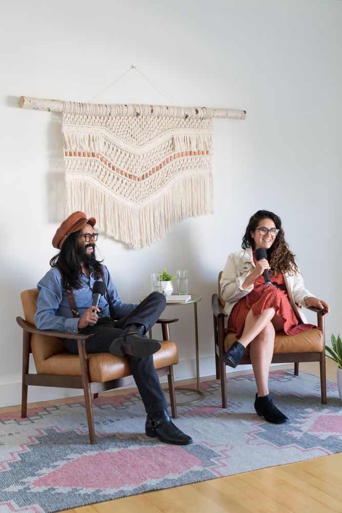 Two colleagues giving a talk with the woman addressing the room