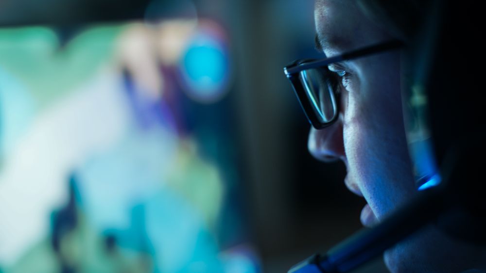 Close-up Shot of Professional Gamer Plays in MMORPG/ Strategy Video Game on His Computer.