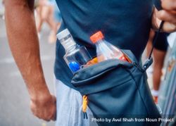 Small bag on man’s body with alcohol for street party 5RQPW0