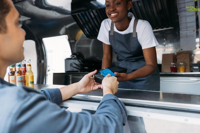 Customer paying with a credit card at a food truck