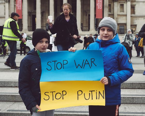 London, England, United Kingdom - March 5 2022: Two boys holding “stop war stop Putin” sign