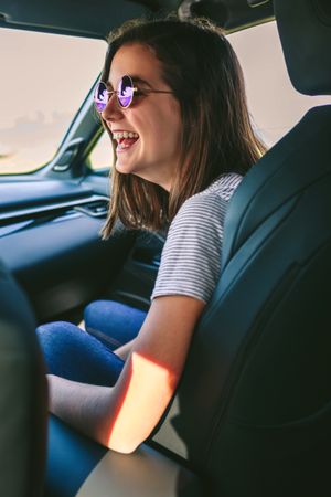 Woman laughing in the car