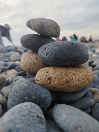 Balanced Stack of Smooth Stones on the Shore