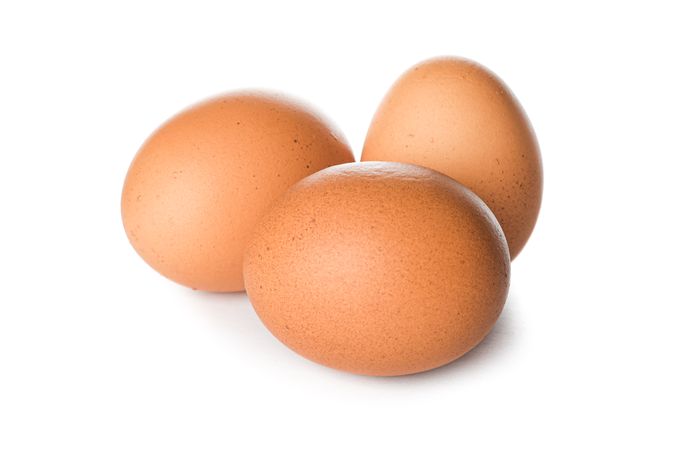 Brown chicken eggs isolated on plain background