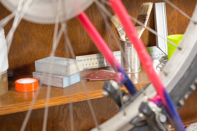 Closeup of bicycle tools over workshop table