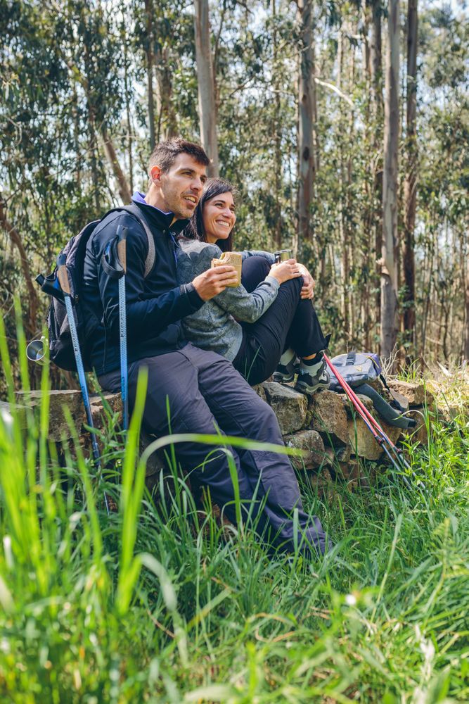 Couple pausing while doing trekking