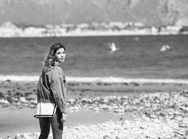 Young woman walking on seashore