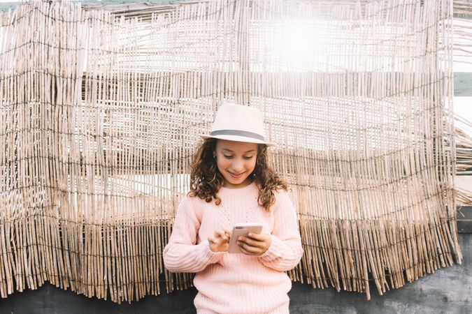 Focused girl using smartphone in countryside