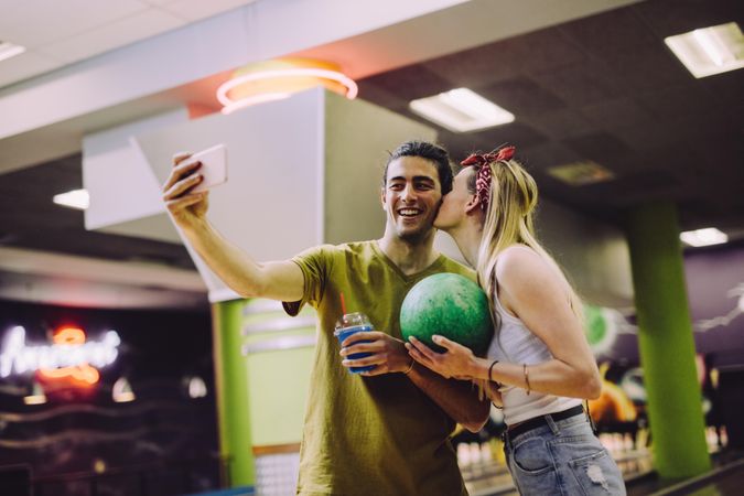 Young couple having a date night at bowling alley