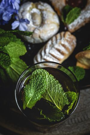 Traditional tea with mint and assorted Arab sweets