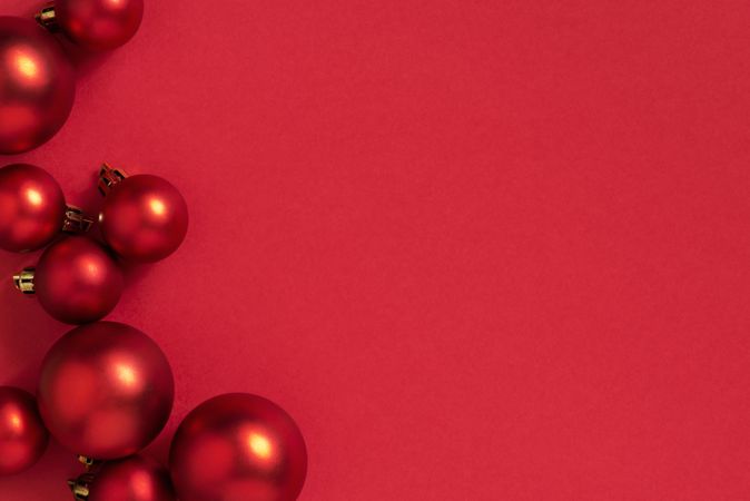 Red holiday baubles with copy space