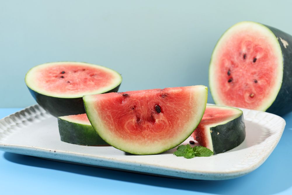 Sliced Red Watermelon on Ceramic Plate