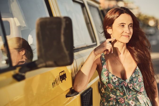 Young woman on a yellow van