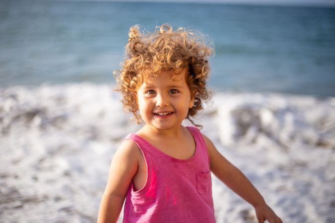 Child near sea on coast