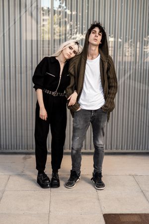 Couple near stripped modern building