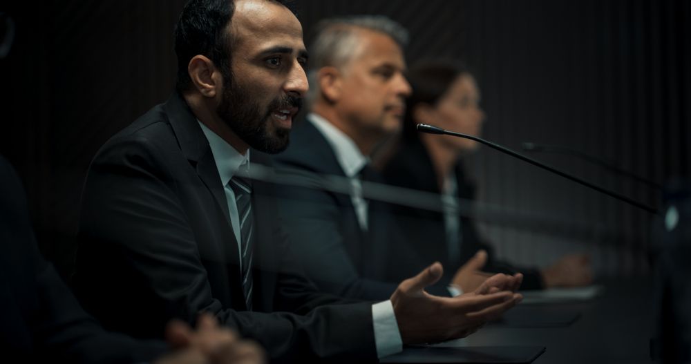 Multiethnic Male Head Of Political Delegation Speaking At International Economic Forum Press Conference.