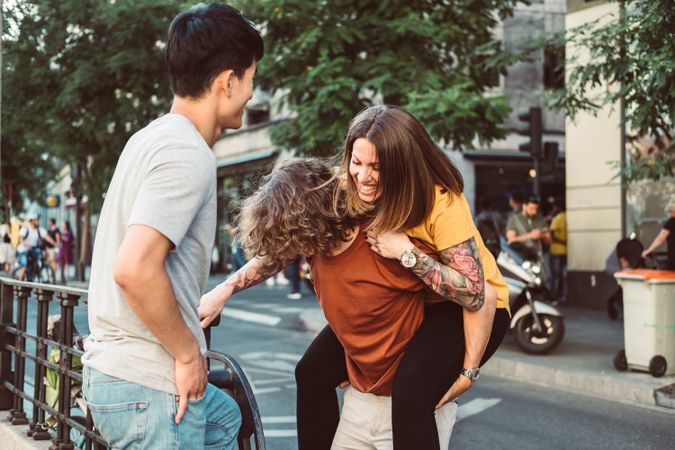 Carefree multiracial friends having fun on street