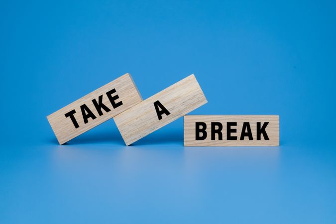 take a break words symbol on wooden blocks isolated on blue background