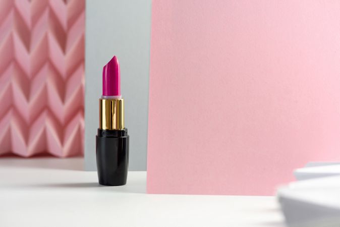 Lipstick on raised pink chevron. Product and make up concept