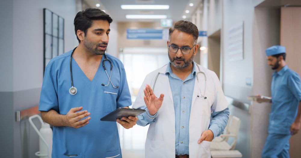 Two Medical Specialists Discussing the Treatment of a Patient