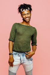 Studio portrait of a young man smiling looking at camera