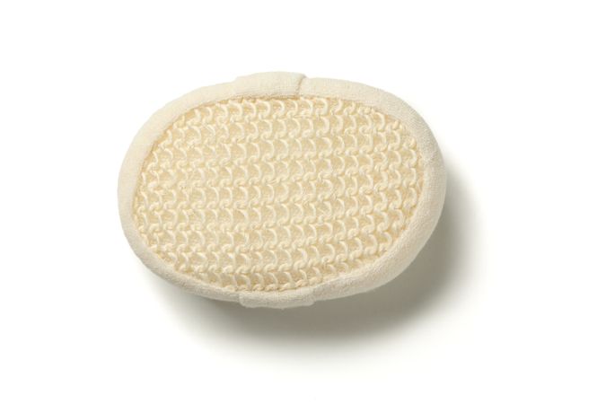 Beige bath sponge isolated on blank background
