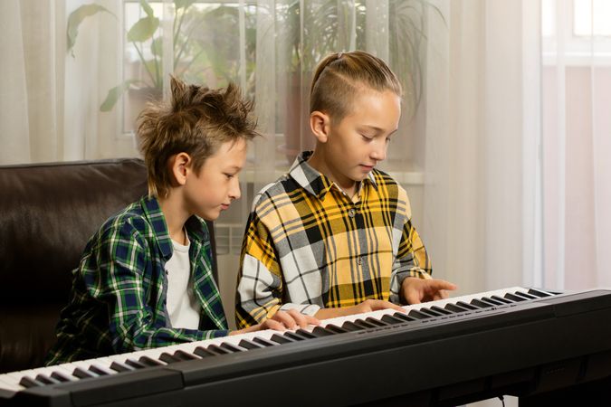 Brothers Sharing Piano Moments